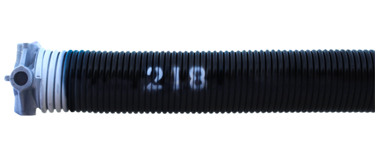 A black torsion spring with the number 218 written on it, painted white at the end, along with cone at one end.